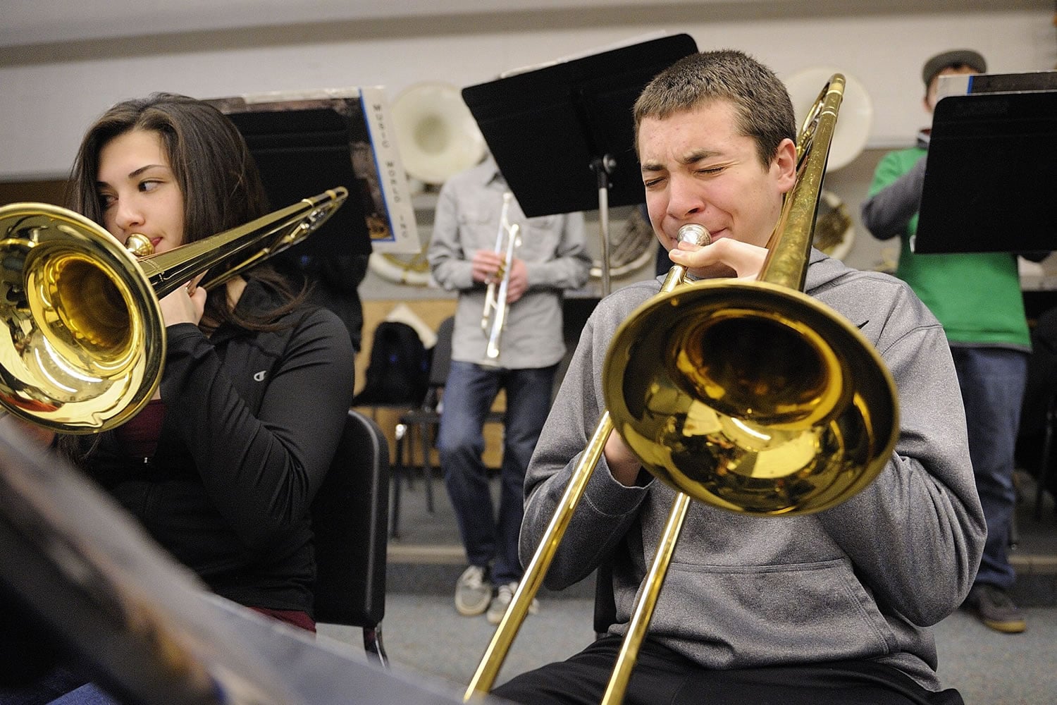 Kaleb Armstrong, 16, and Keiko Inouye, 15, play trombones in the Battle Ground High advanced jazz band.