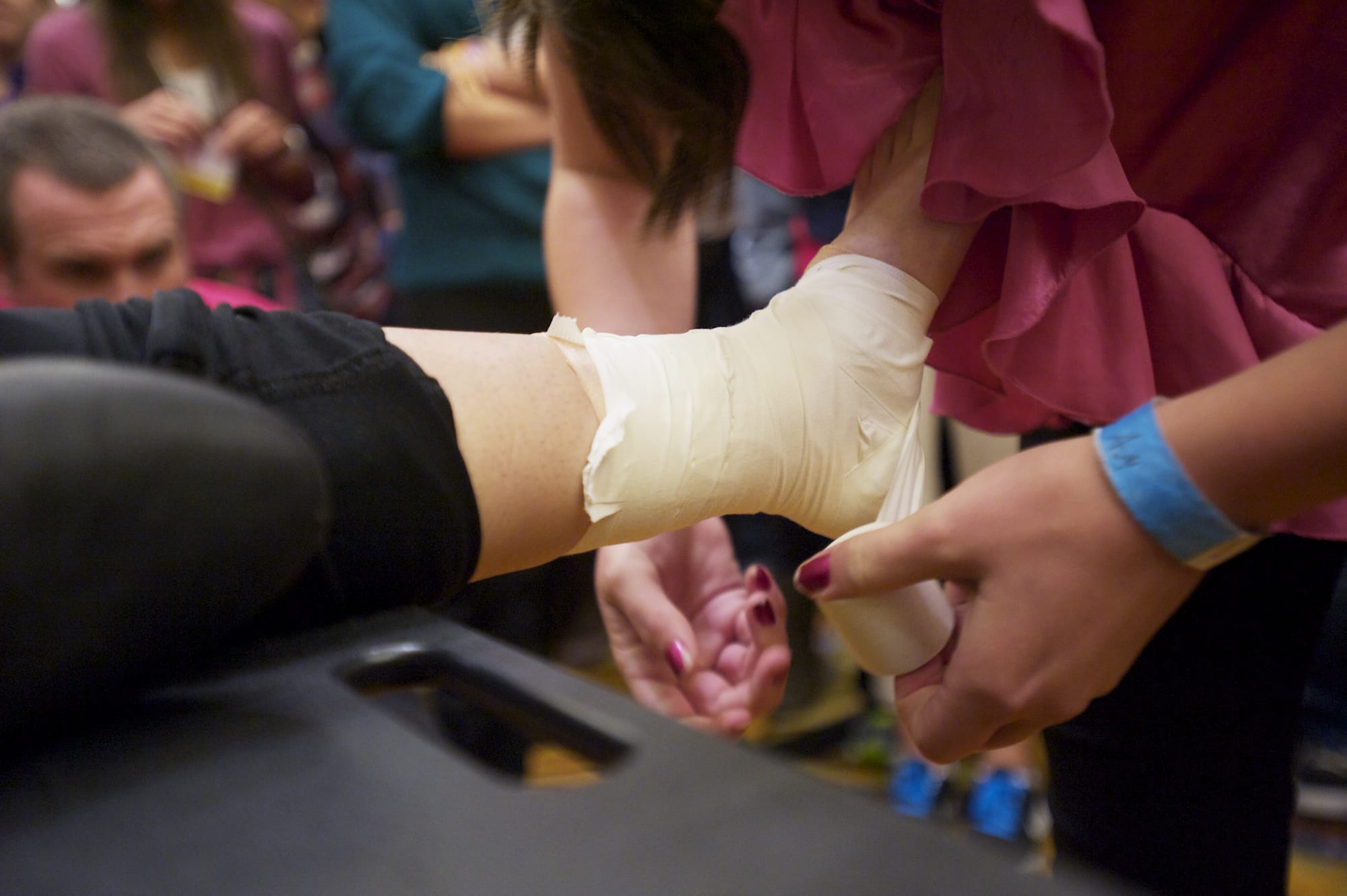 Students compete Saturday in a timed ankle-taping event at the Washington Career and Technical Sports Medicine Association's State Sports Medicine Competition and Symposium at the Hilton Vancouver Washington.