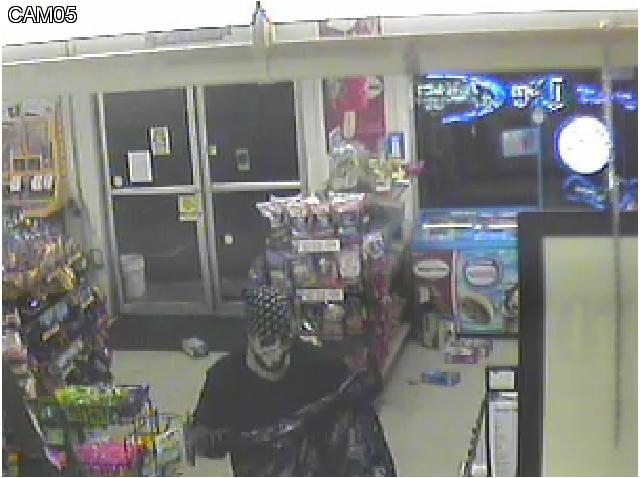 Battle Ground Police Department
Security video shows a man robbing the IQ Minit Mart in Battle Ground.