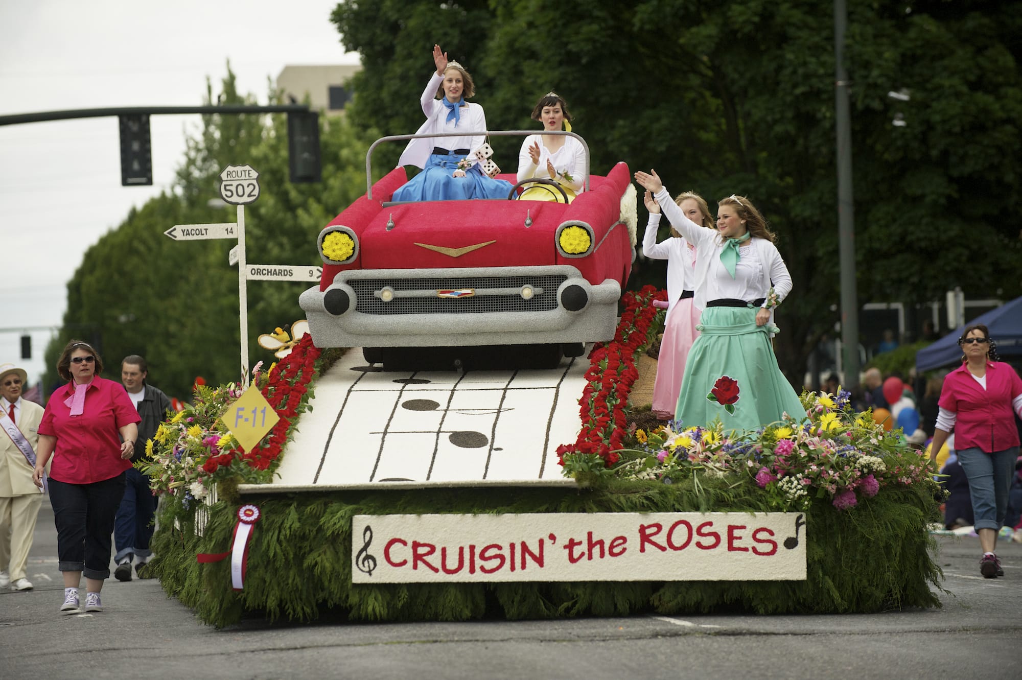 The Battle Ground float cruises the Rose Festival Grand Floral Parade in Portland on Saturday.