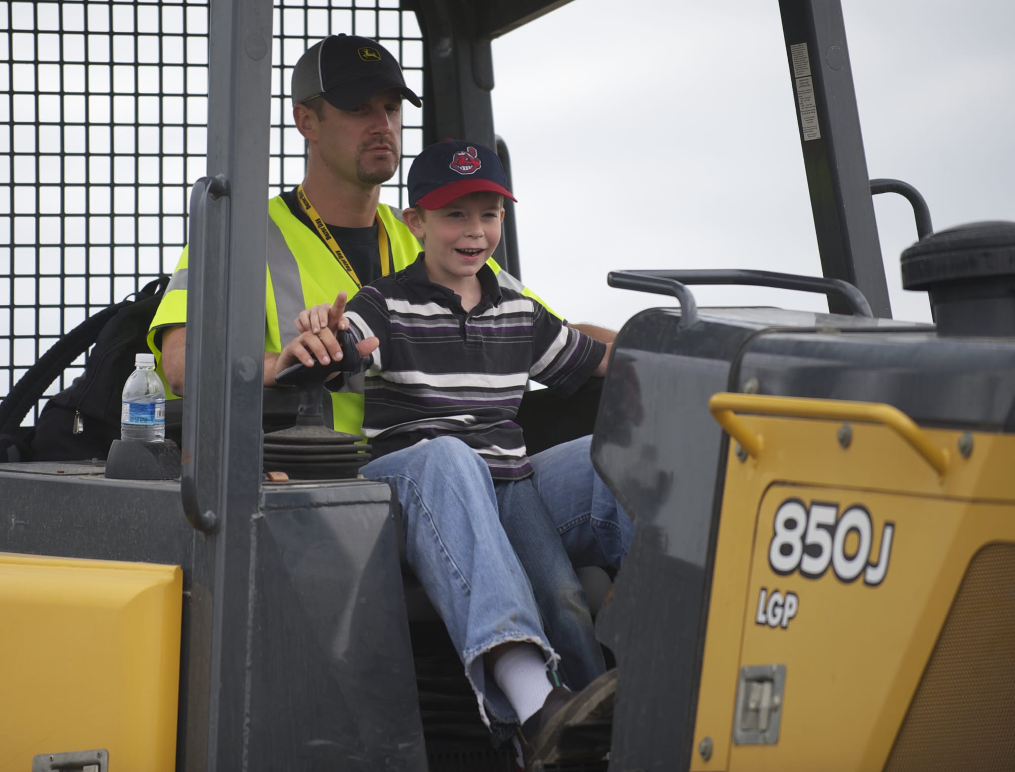 Derek Fechtner, 6, of Woodland takes his turn operating a Deere 850J bulldozer Sunday afternoon.