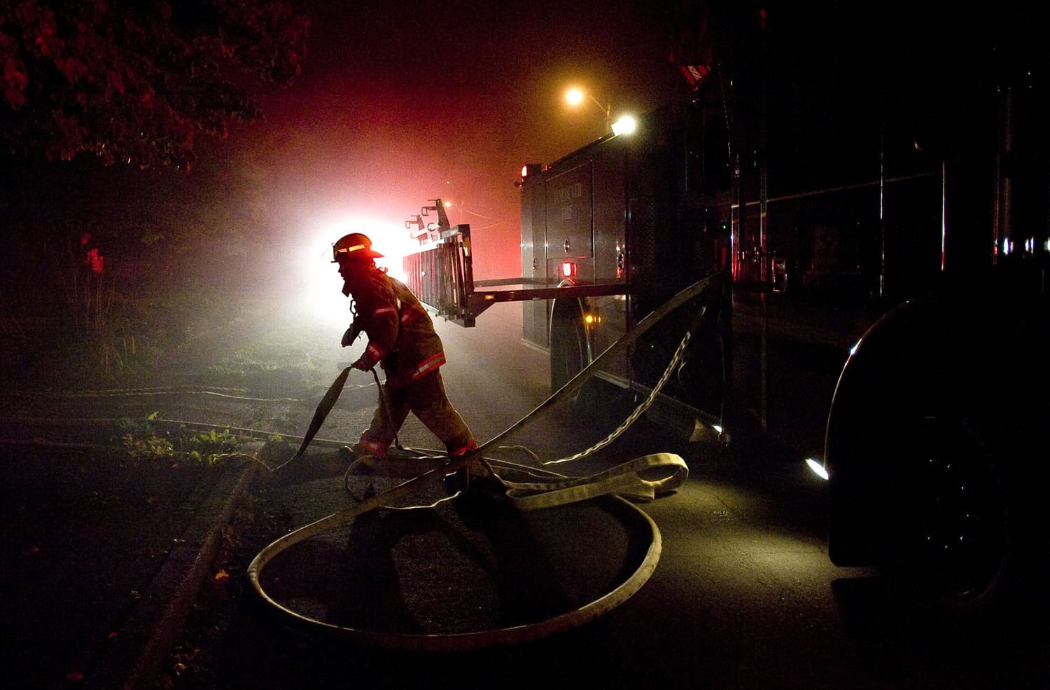 Firefighters respond to an attic fire inside a home on N.W. 45th Street near Franklin Street on Sept.