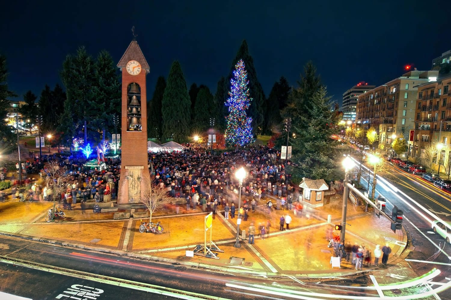 Revelers gather in Esther Short Park early Friday evening after the annual lighting of the park's Christmas tree.