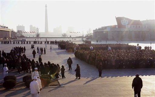 Mourners line up in Kim Il Sung Square to pay respects to late North Korean leader Kim Jong Il in Pyongyang, North Korea, early Monday.