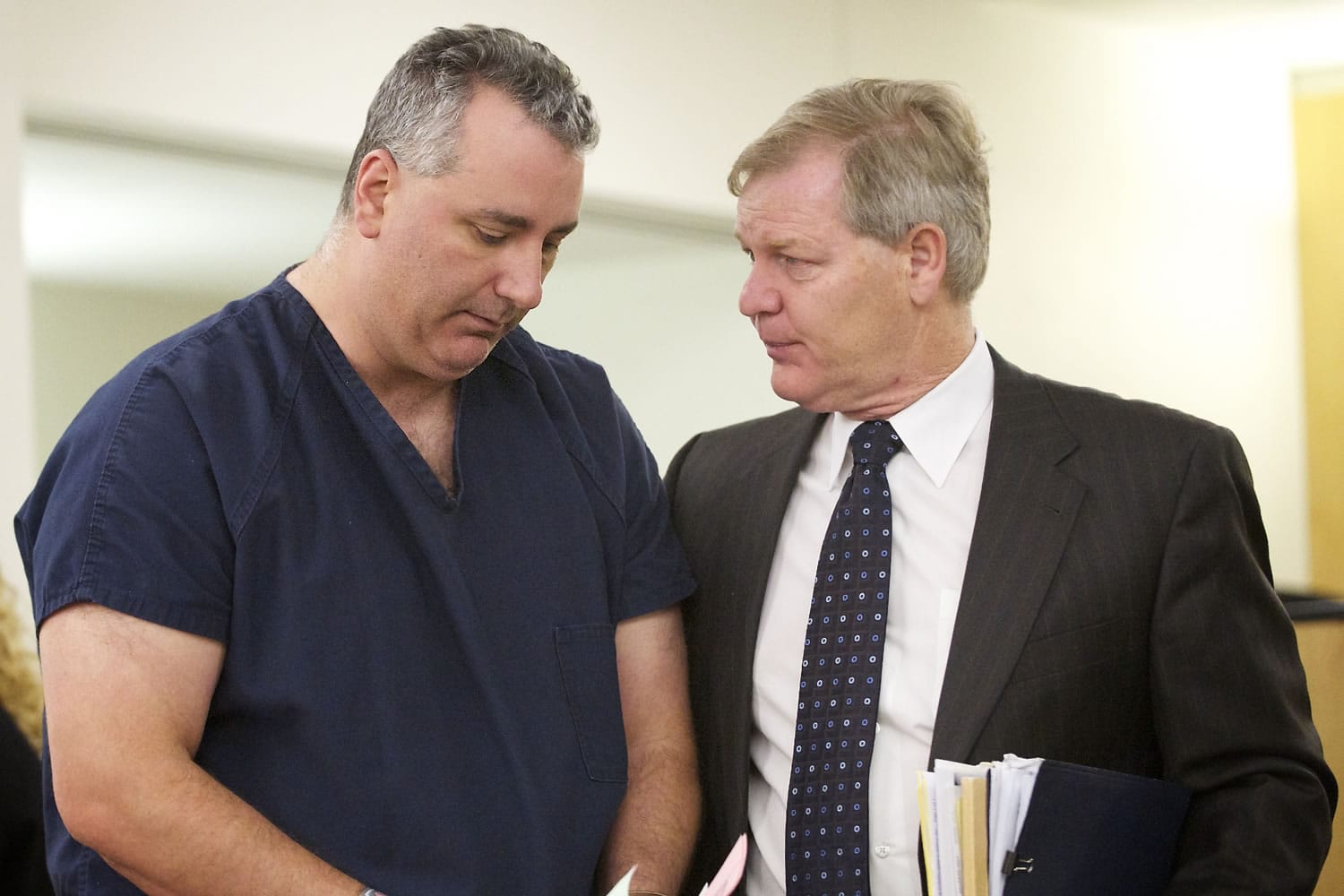 Steven P. Hyson, left, speaks with his attorney, Thomas Phelan, Friday May 4, 2012 at arraignment court in Vancouver, Washington. Hyson is accused of assaulting his 22-year-old stepson on Tuesday, according to a news release from the Clackamas County, Ore. sheriffis office.
