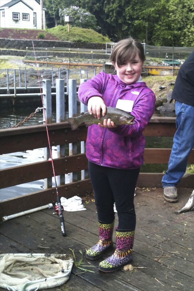 Charlie Downs is proud as can be of her haul at Kids Fishing Festival.