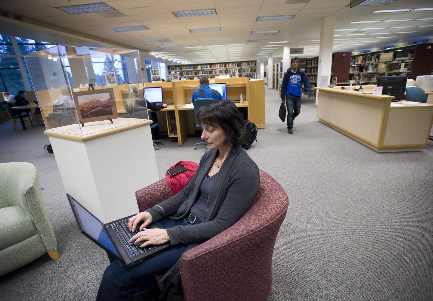 Gerontology student Maria Lattanzi, 53, works on a final paper on adult development and aging at the Washington State University Vancouver library.
