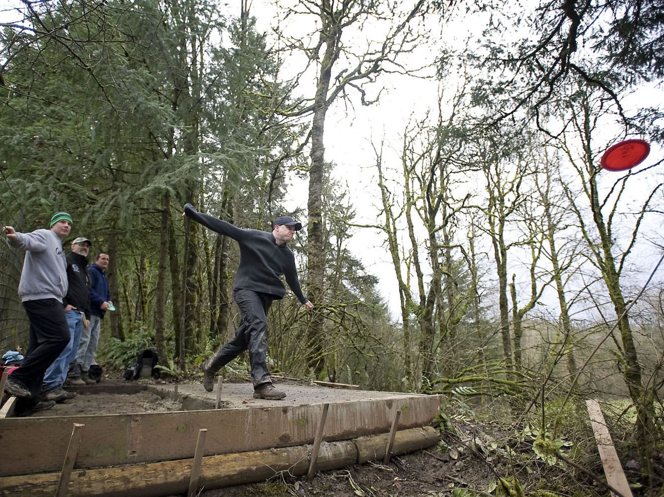 Josh Dearing of Vancouver takes his first shot on Sunday from the tee box of the third hole at the new disc golf course at Paradise Point State Park in La Center.