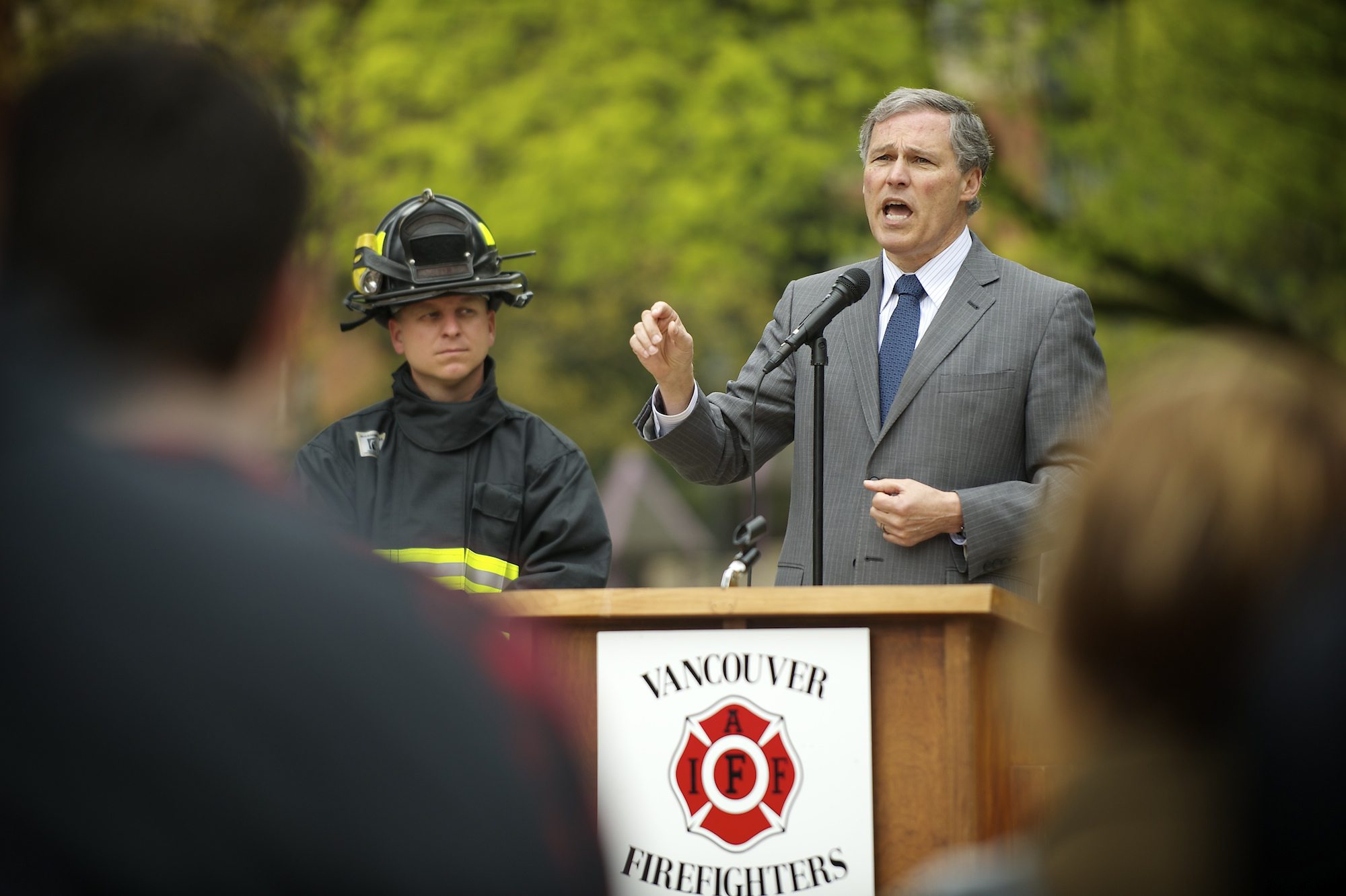 Democratic gubernatorial candidate Jay Inslee speaks to firefighters and firefighter representatives at a rally for the Inslee campaign on Tuesday at Esther Short Park in Vancouver.