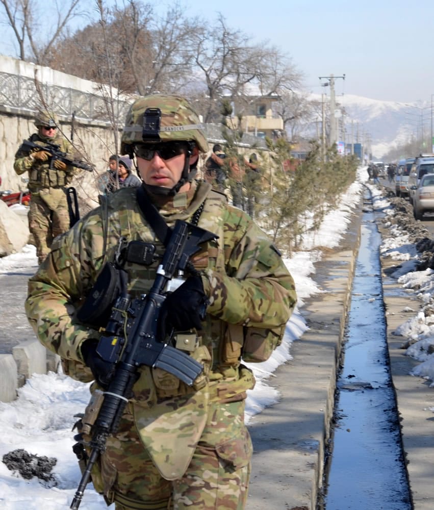 Oregon National Guard Staff Sgt. Curtis Sanders of Vancouver and his soldiers patrol a snowy neighborhood in Kabul.