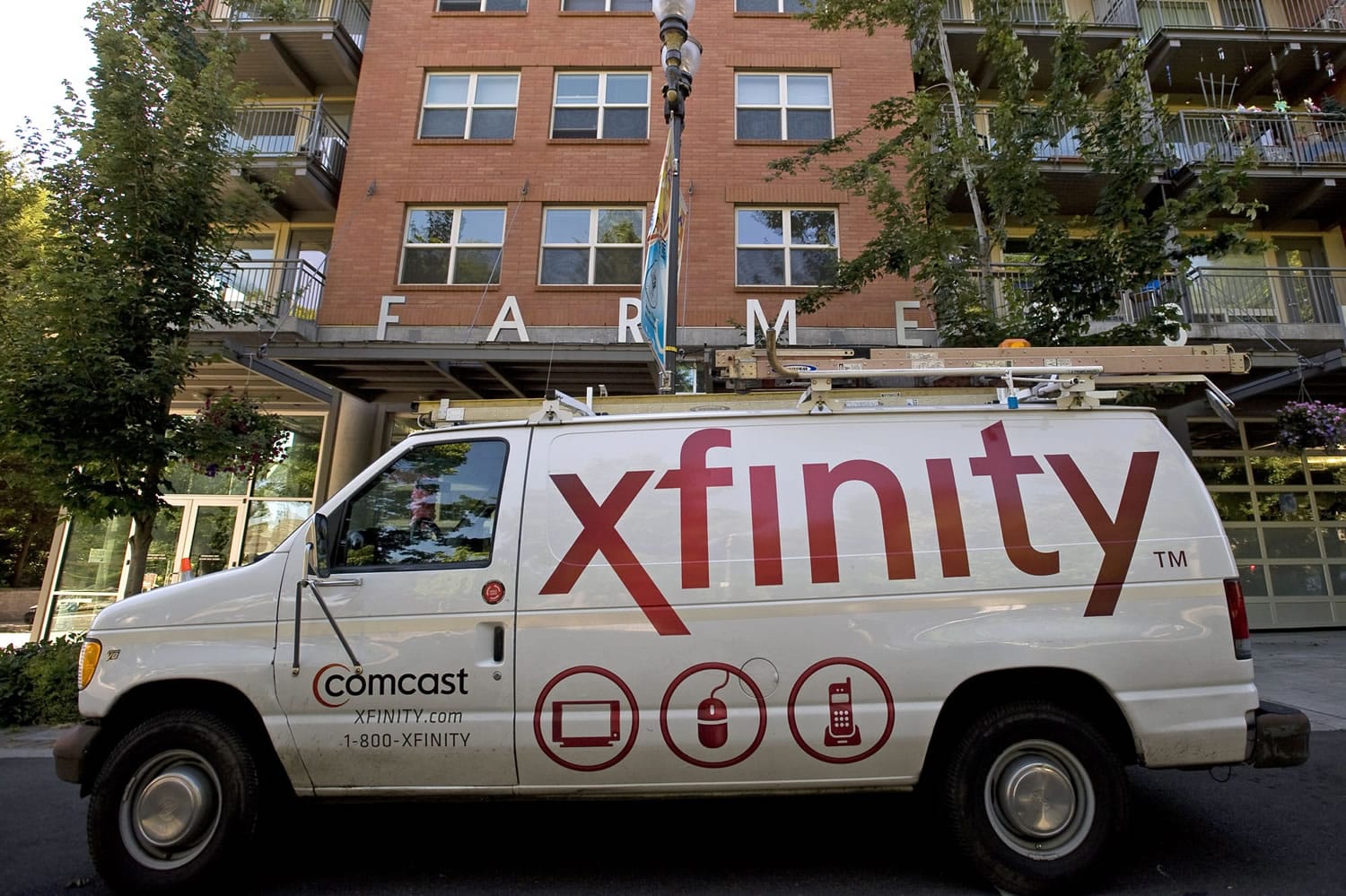 A Comcast van is parked  in downtown Vancouver in July 2011.