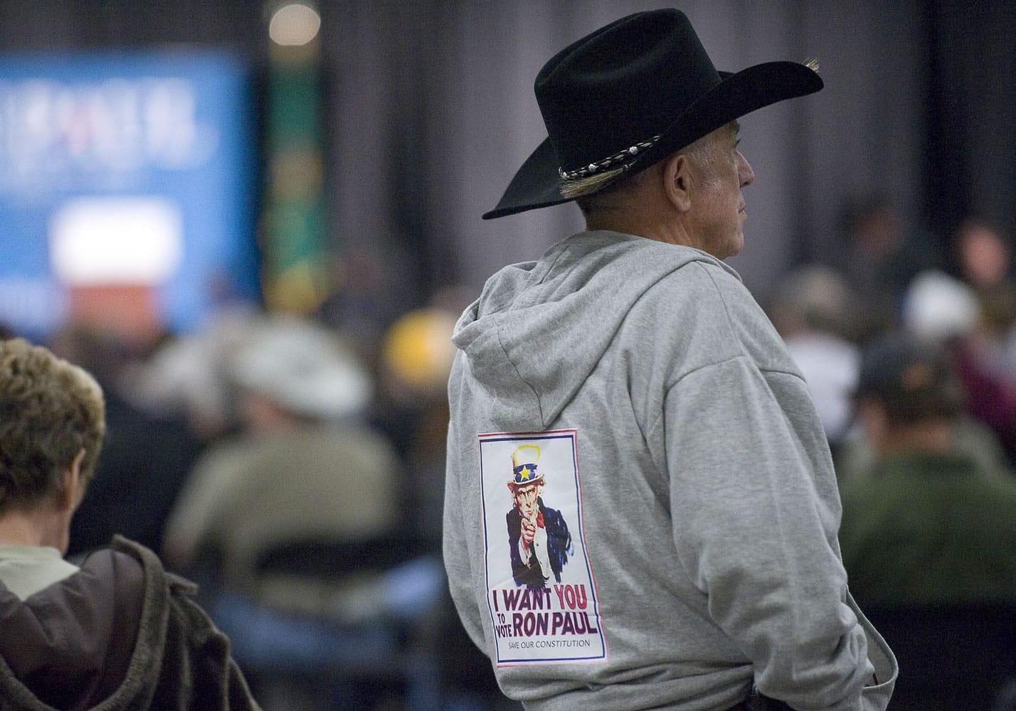 Gary Byers, of Brush Prairie, sports a Ron Paul sweatshirt that his wife made while he waits to hear Paul speak during a rally on Friday at the Clark County Events Center at the Fairgrounds.