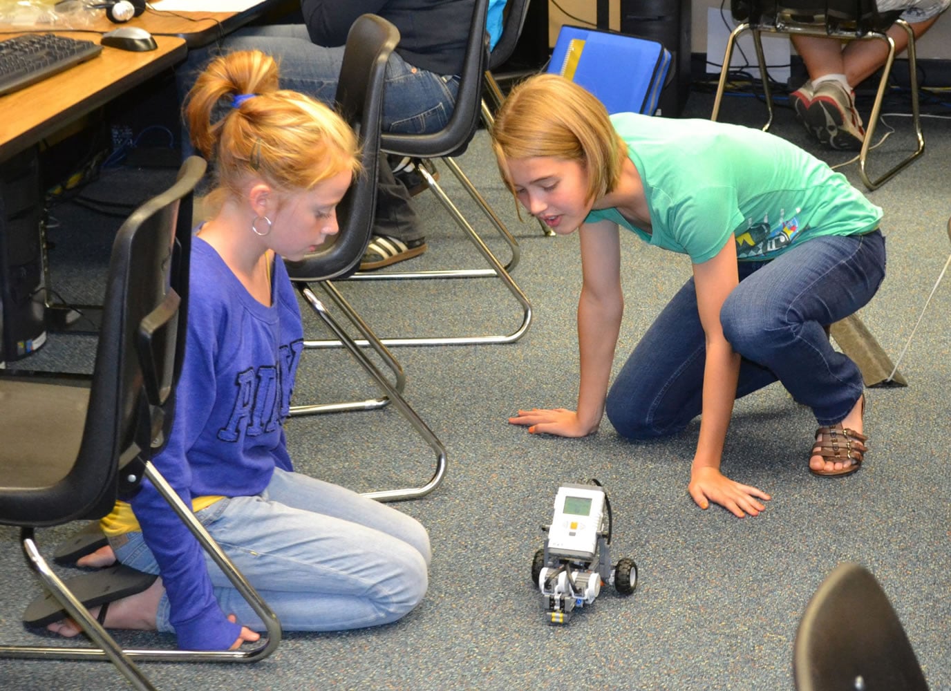 Ridgefield: View Ridge Middle School seventh-graders Helena Bockstadter, left, and Lauren Rath study a robot in their applied technology class.
