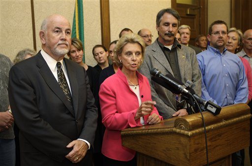 From left, Tacoma Public Schools Superintendent Art Jarvis, left, Washington Gov. Chris Gregoire, Tacoma School Board President Kurt Miller, and Andy Coons, president of the Tacoma Education Association, announce Wednesday, Sept. 21, 2011, that a tentative agreement has been reached in the Tacoma teachers strike, following a negotiating session in Gregoire's office at the Capitol in Olympia, Wash. Parties from both sides of a Tacoma teachers' strike were summoned to the Governor's office Wednesday after failing so far to reach an agreement. (AP Photo/Ted S.