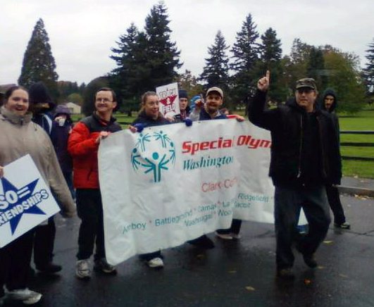Hudson's Bay: Combat veteran and Clark County Special Olympics Washington sports coordinator Rick Cook, led the Special Olympics athletes, unified partners, coaches and families in the Veterans Day Parade on Nov.