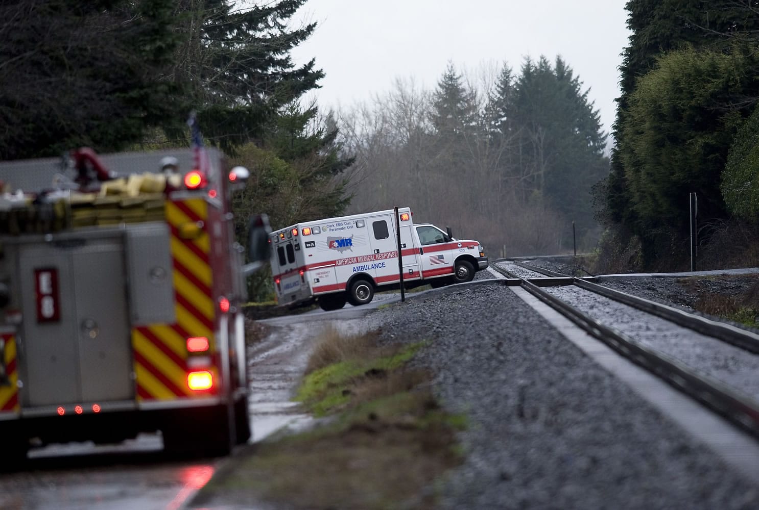 An ambulance leaves a private dock carrying Ana R. Ramos, 30, of Vancouver, who reportedly jumped from the northwest side of the I-205 bridge shortly after 1 p.m. Friday.