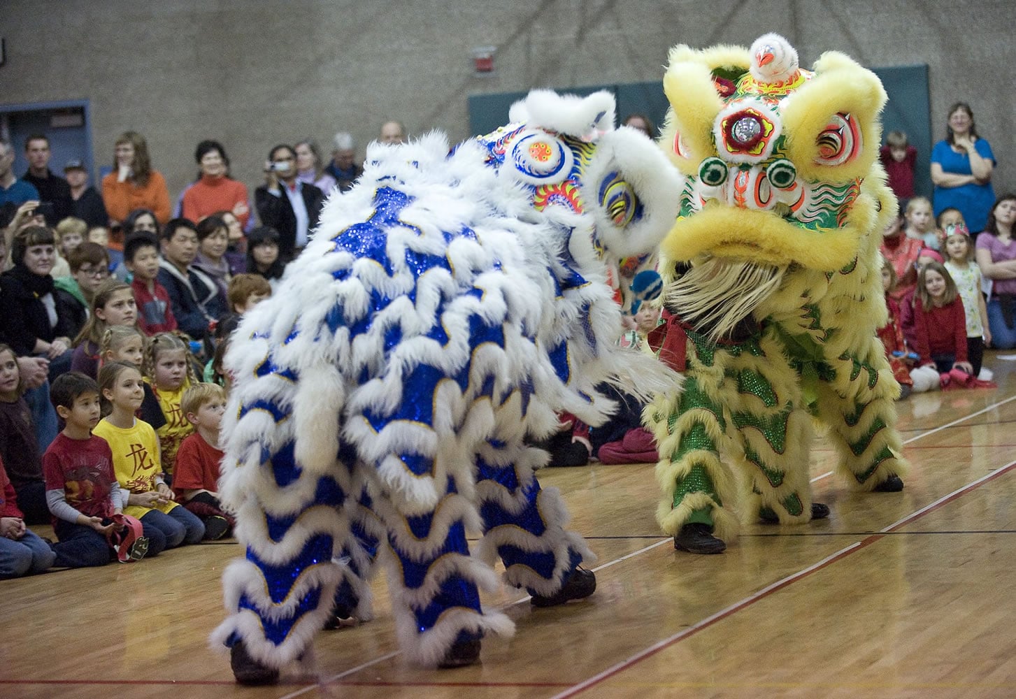 Portland Lee's Association Lion Dance Team performs during a program to celebrate the Chinese New Year at Ben Franklin Elementary School on Friday.