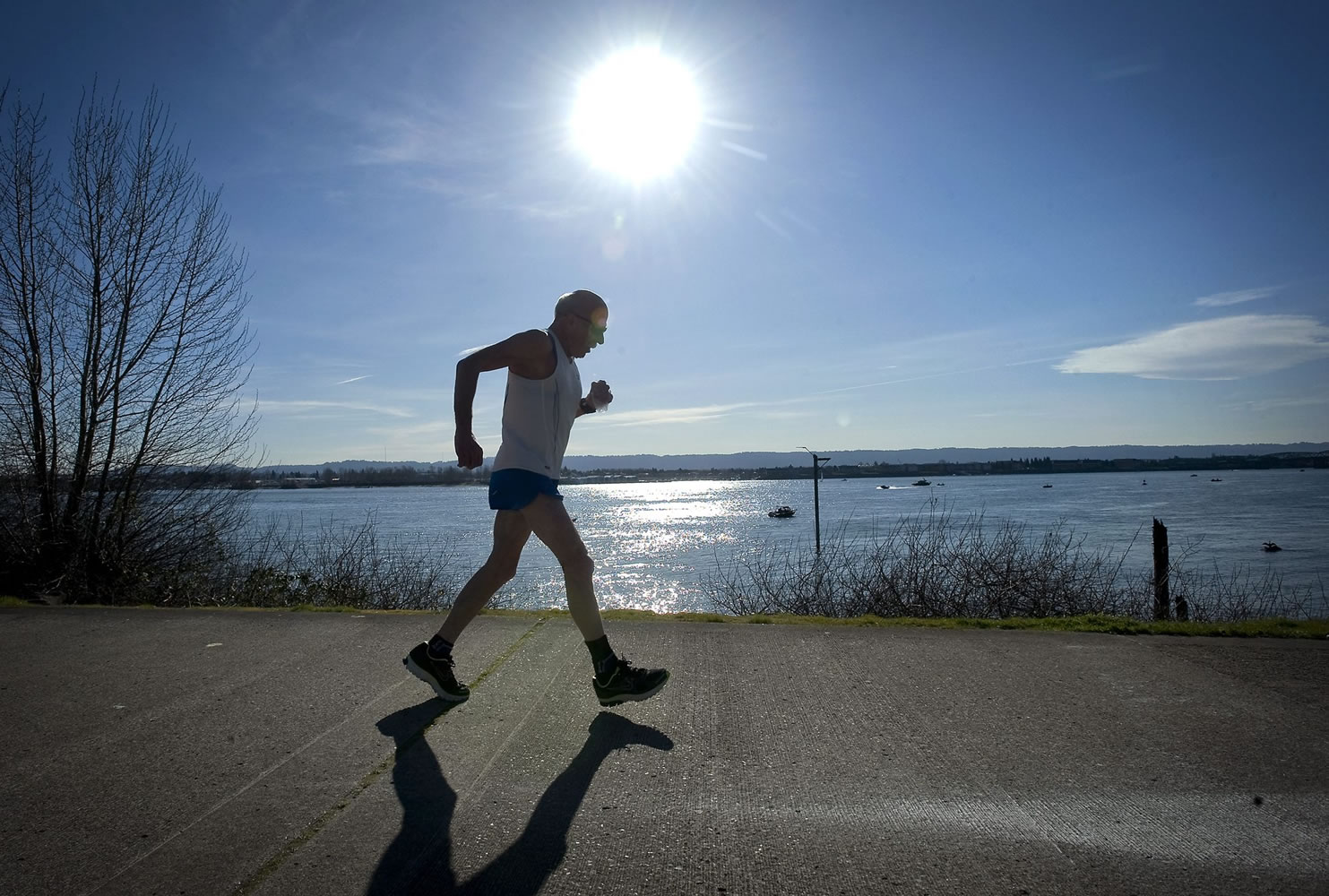 Jim Scheer, who turns 70 on Tuesday, runs along the Waterfront Renaissance Trail in Vancouver on Thursday.