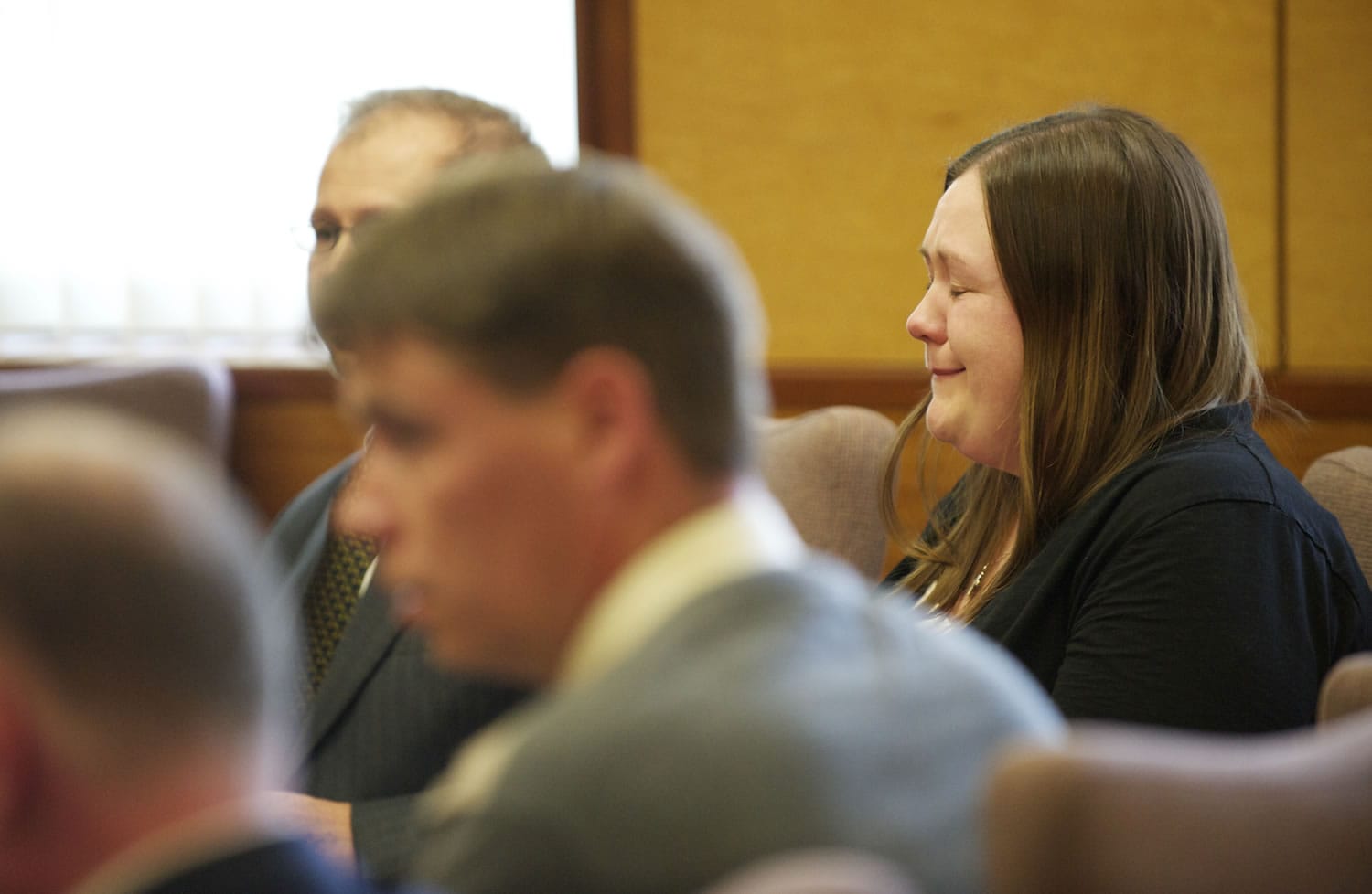 Alayna Higdon reacts Tuesday when a Clark County jury acquitted her and John Eckhart of unlawful imprisonment in connection with their practice of locking Eckhart's two autistic sons in a bedroom secured with a cage-like door.