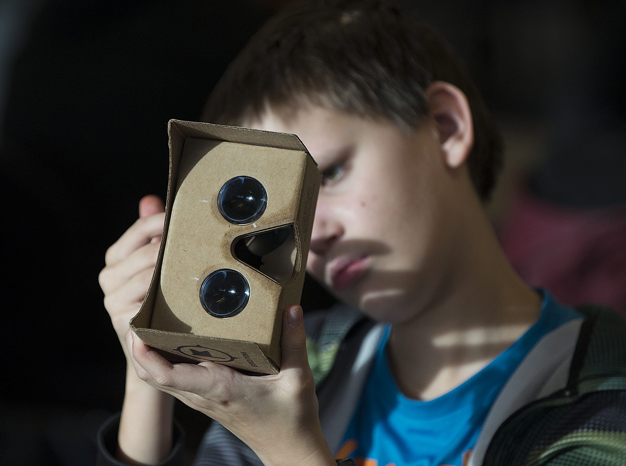 Chief Umtuch Middle School eighth-grader Layson Ek, 13, checks out his virtual reality cardboard viewer Thursday morning. Three Battle Ground schools are participating in a pilot program to field test the Google Expeditions Pioneer Program that allows students to travel the world through virtual field trips.