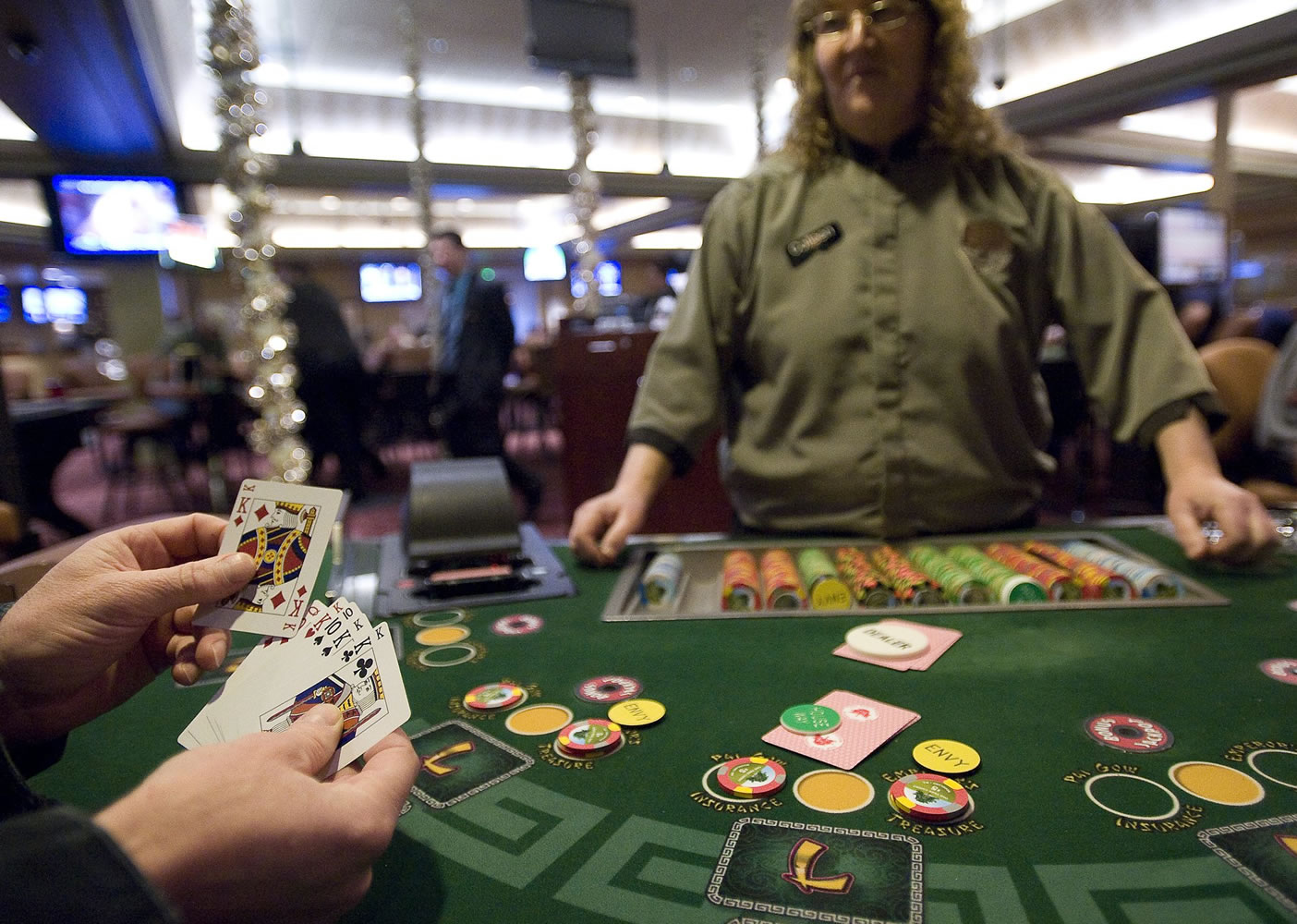 Colleen Thompson deals a Pai Gow player four kings Feb. 9 at the Oak Tree Casino in Woodland.