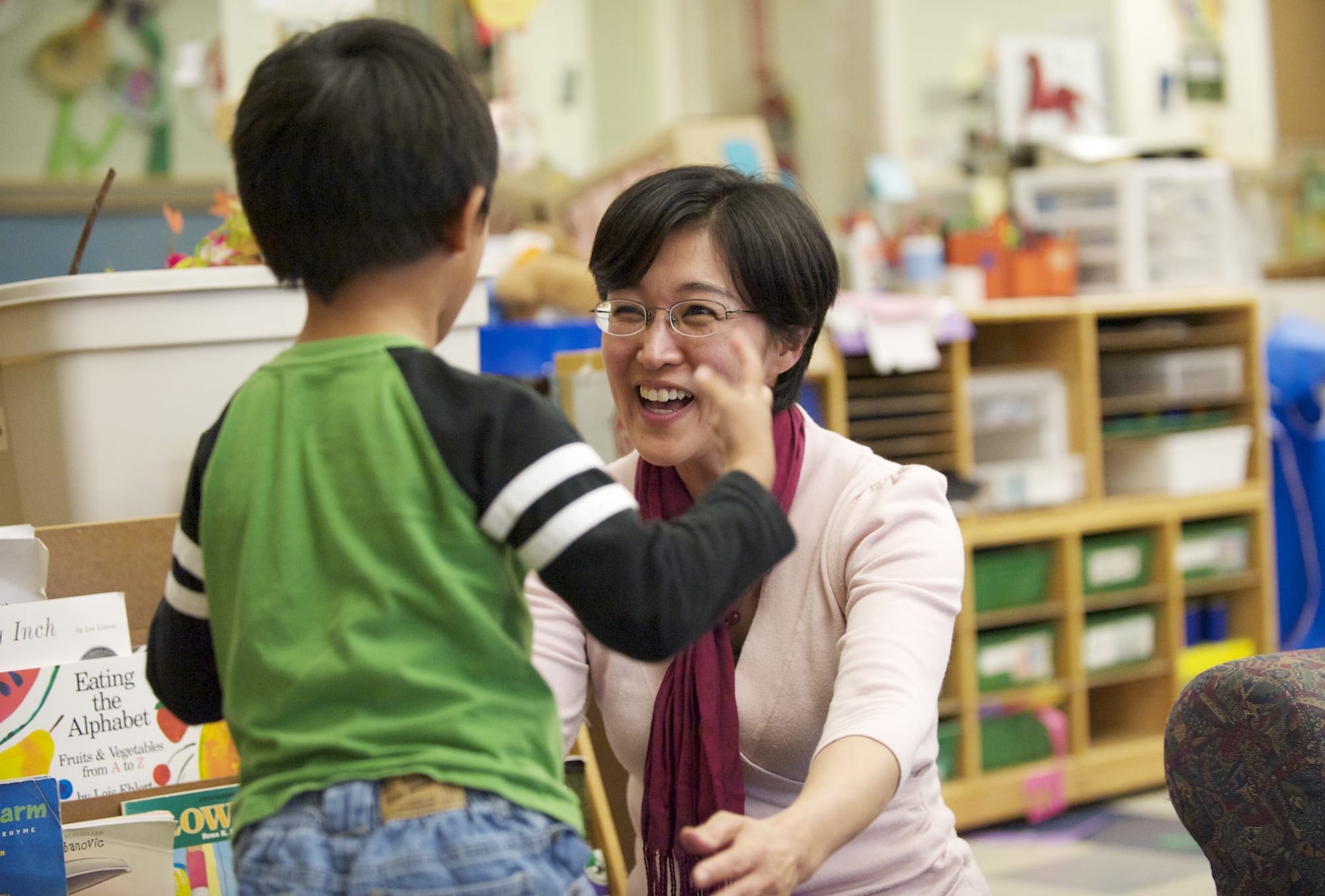 Yoshie Sano, assistant professor of human development at Washington State University Vancouver, picks up her 5-year-old son, Reon Sano-Ochiai, at the WSUV Childhood Development Center.