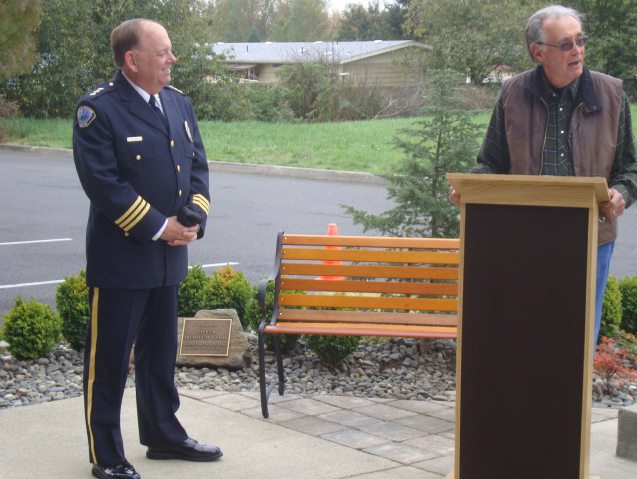Battle Ground: 
 Chief Bob Richardson, left, and Richard Molzahn, dedicate a memorial plaque (seen in the background) to Officer Michael Molzahn, who died in an off-duty accident in July.