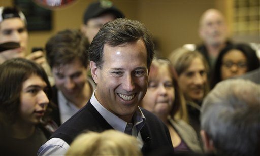 Republican presidential candidate former Pennsylvania Senator Rick Santorum speaks to local residents during a campaign stop at the Daily Grind coffee shop, Sunday in Sioux City, Iowa.