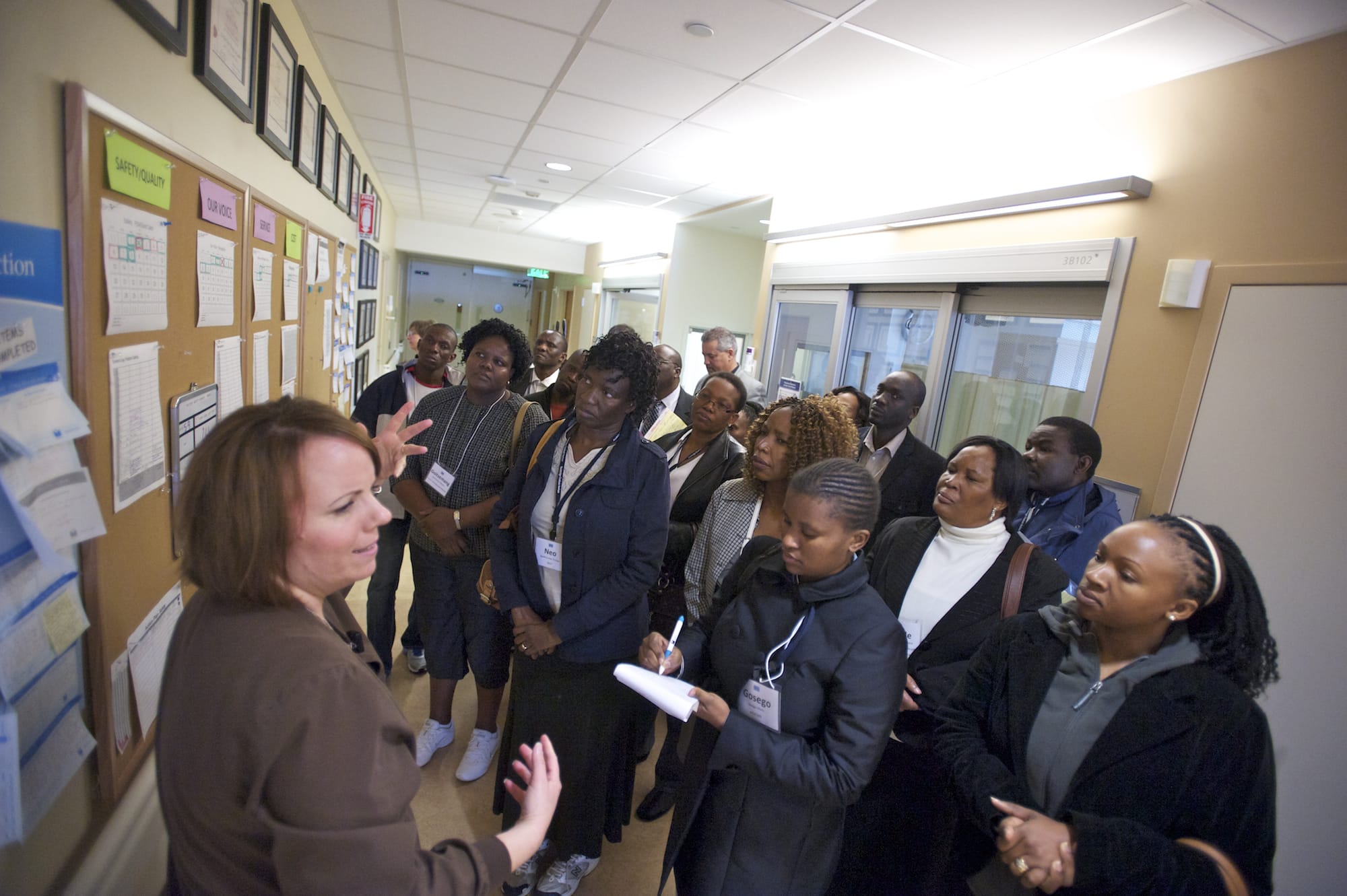 Charge Nurse Sandra Welker, left, leads a delegation of civic, health and government officials from the Republic of Botswana on a tour of Legacy Salmon Creek Medical Center's intensive-care unit.