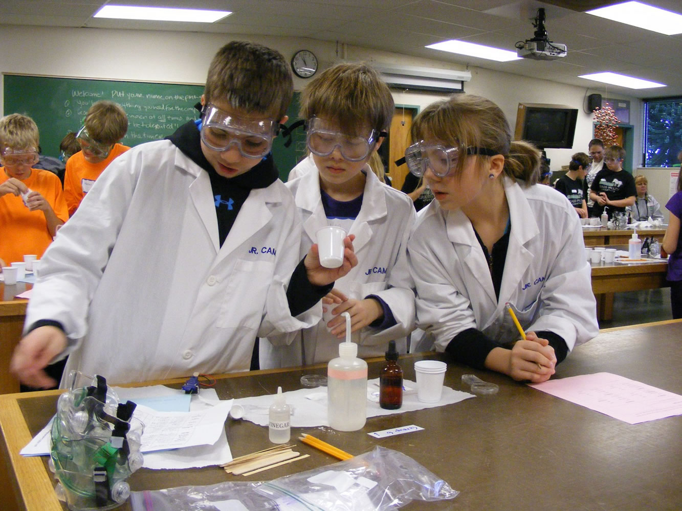 Battle Ground: HomeLink students, from left, Tom Hapgood, Neo Chick and Lauren Hapgood, participate in the &quot;Pondering Powders&quot; event at the Science Olympiad at Clark College. The object was to identify four different powders from among several possibilities, including corn starch, flour, sugar, salt, white sand, baking soda and gelatin.