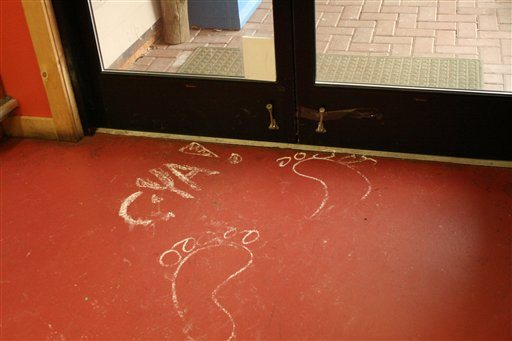 In this Feb. 11, 2010 file photo provided by the Islands' Sounder newspaper, chalk drawings of bare feet are shown on the floor of the Homegrown Market on Orcas Island, Wash., after the store was broken into overnight. The crime was blamed on Colton Harris-Moore, better known as the &quot;Barefoot Bandit,&quot; who on Friday, Dec. 16, 2011 is expected to plead guilty to about 30 state felony charges arising from a two-year, cross-country crime spree in stolen planes, boats and cars.