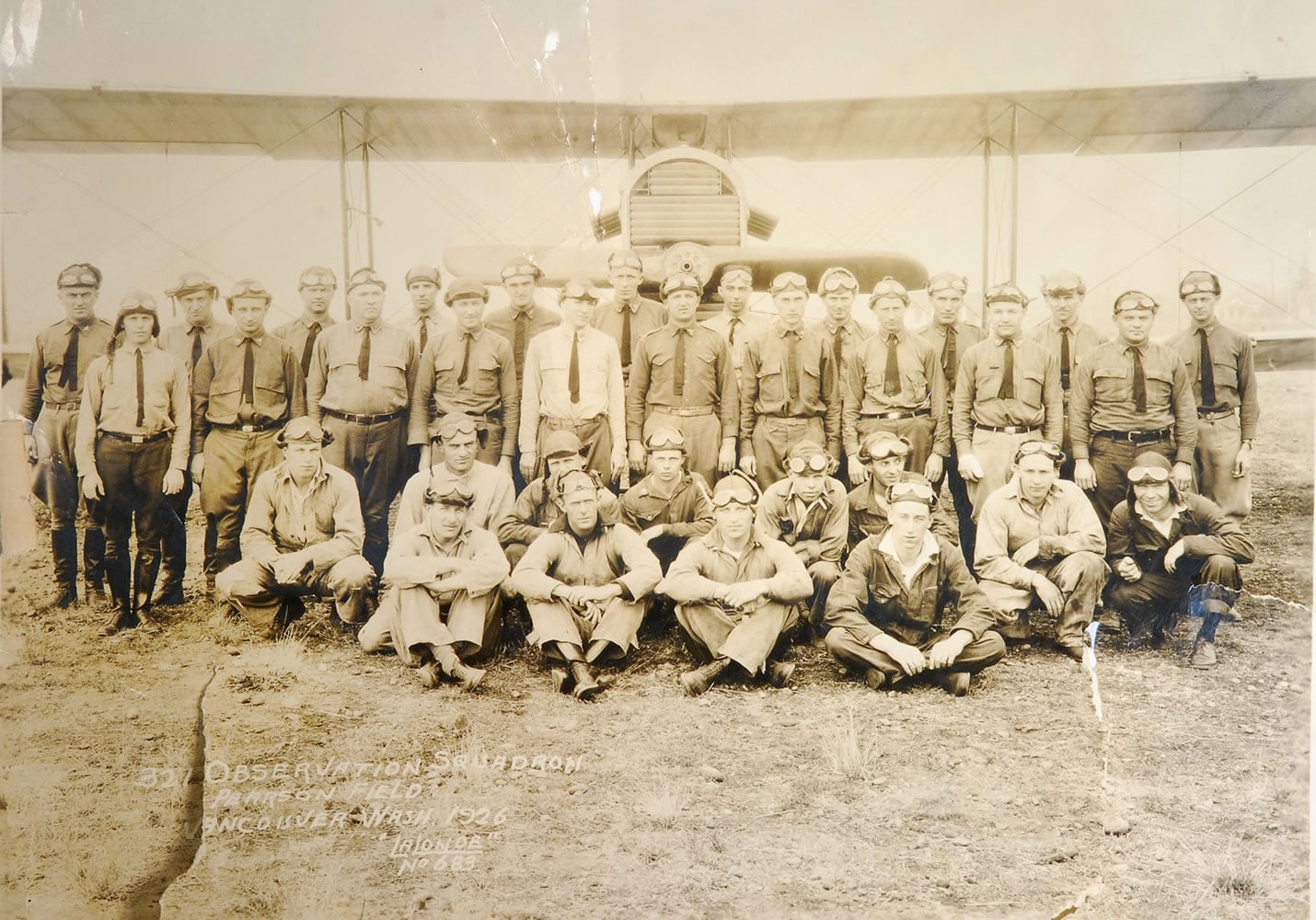 Men of the Army&#039;s 321st Observation Squadron in the 1920s, assembled in front of a DH-4 Liberty at Pearson Field.