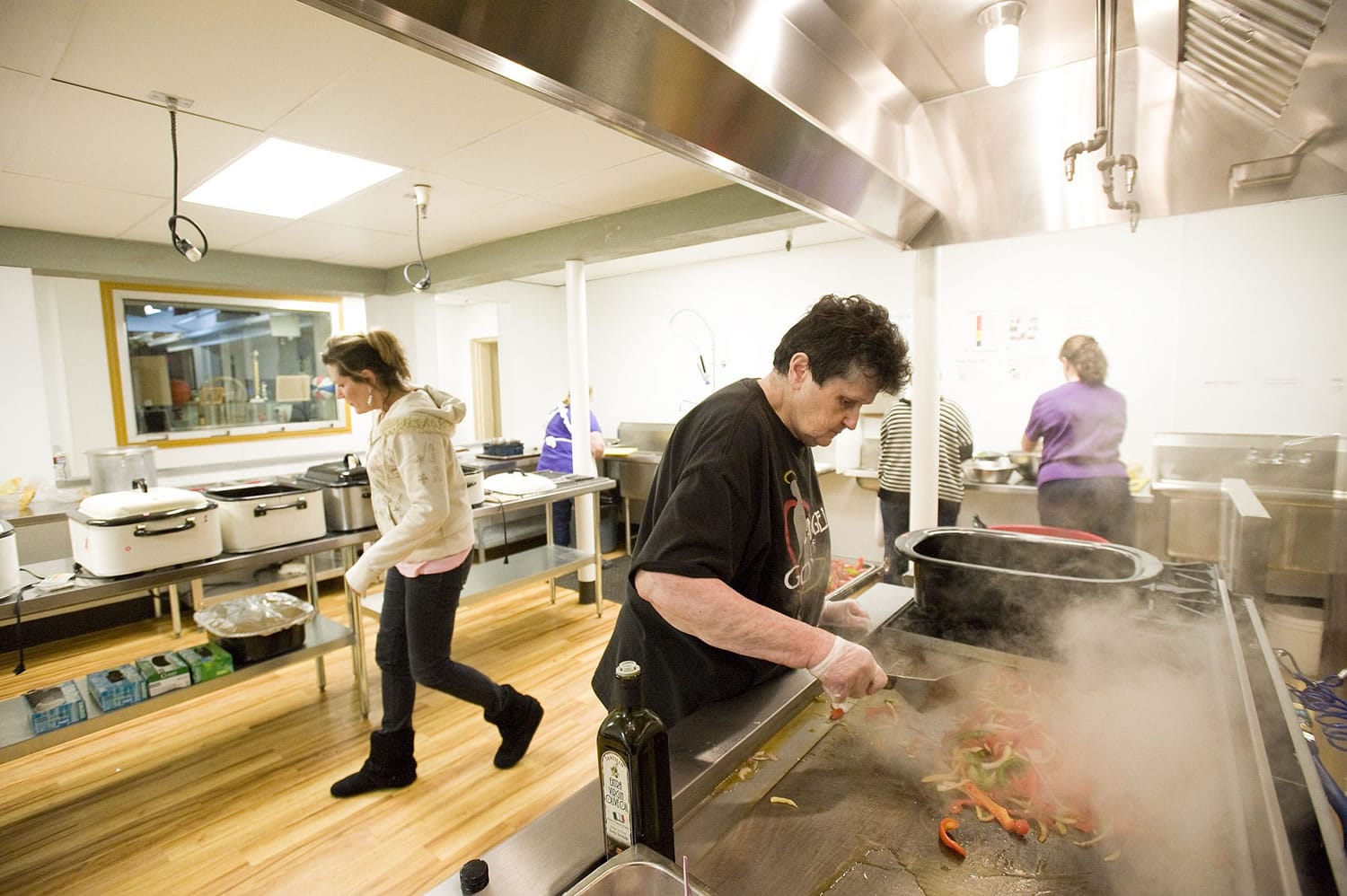 Photos by Steven Lane/The Columbian
Volunteer cook Violet Adams sautes vegetables in the brand new kitchen at The Lord's Gym in preparation for Feb. 10 hot meal service.