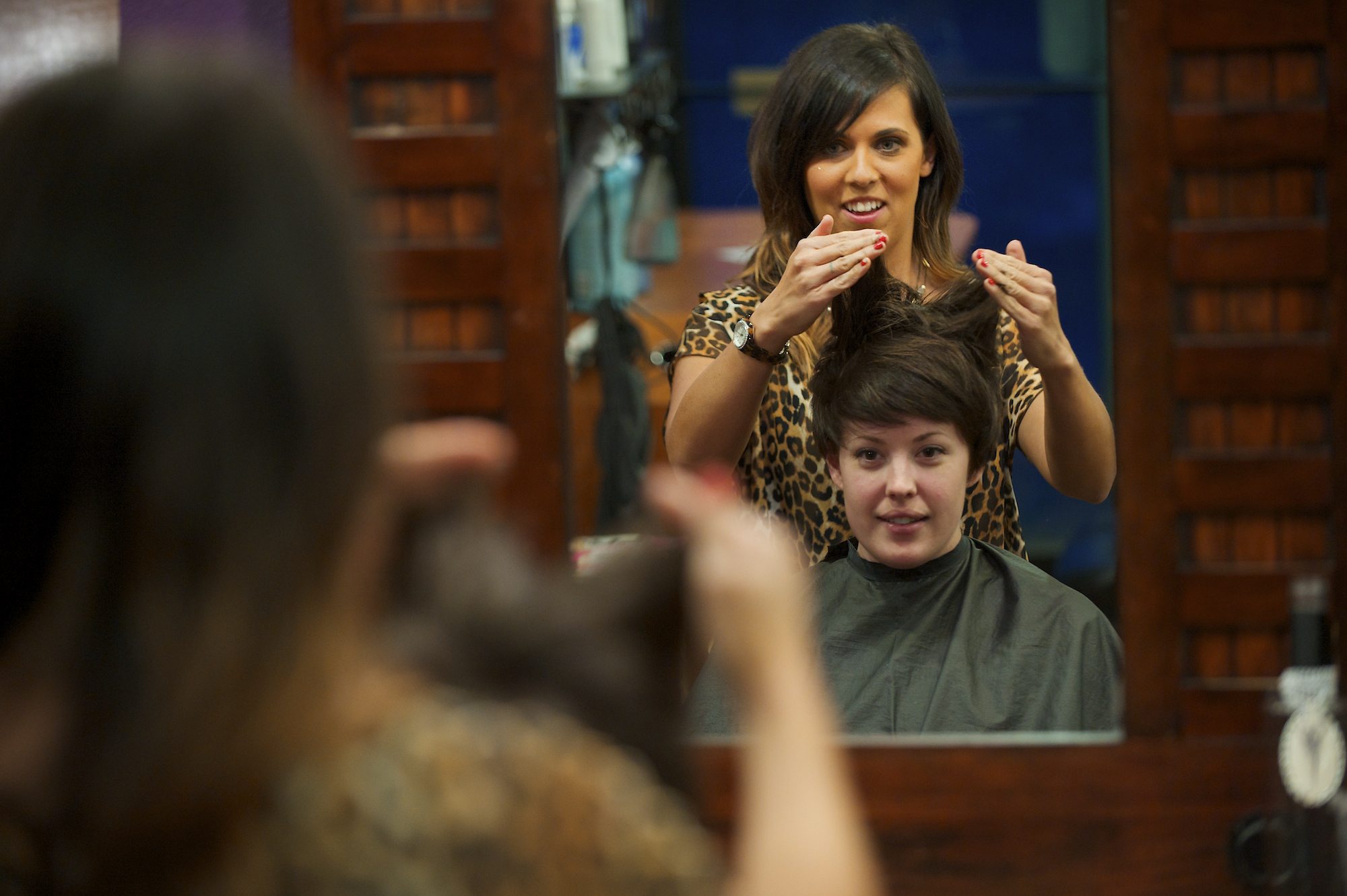 Lea Graves gives Tabi Evans a haircut in Vancouver on April 17.