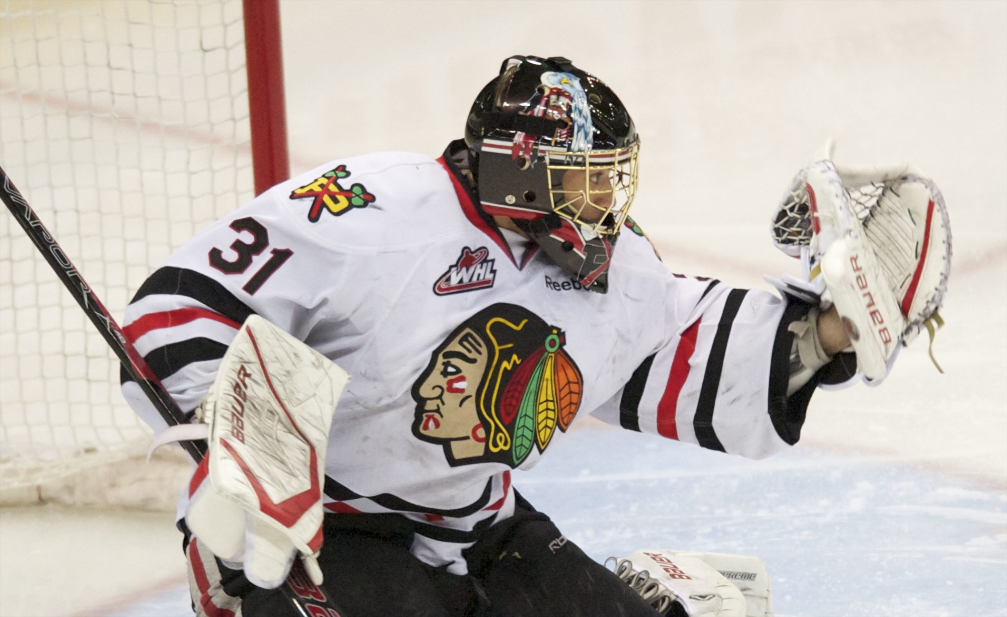 Portland Winterhawks goaltender Mac Carruth makes a save against the Kamloops Blazers during Game 7 of their WHL Western Conference semifinal series Wednesday at Memorial Coliseum in Portland.