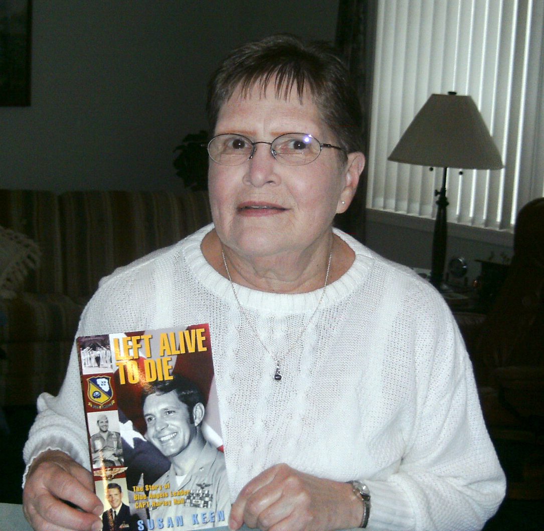 Minnehaha: Gwen Davis shows the book &quot;Left Alive to Die&quot; written about her brother, Navy Capt. Harley Hall.