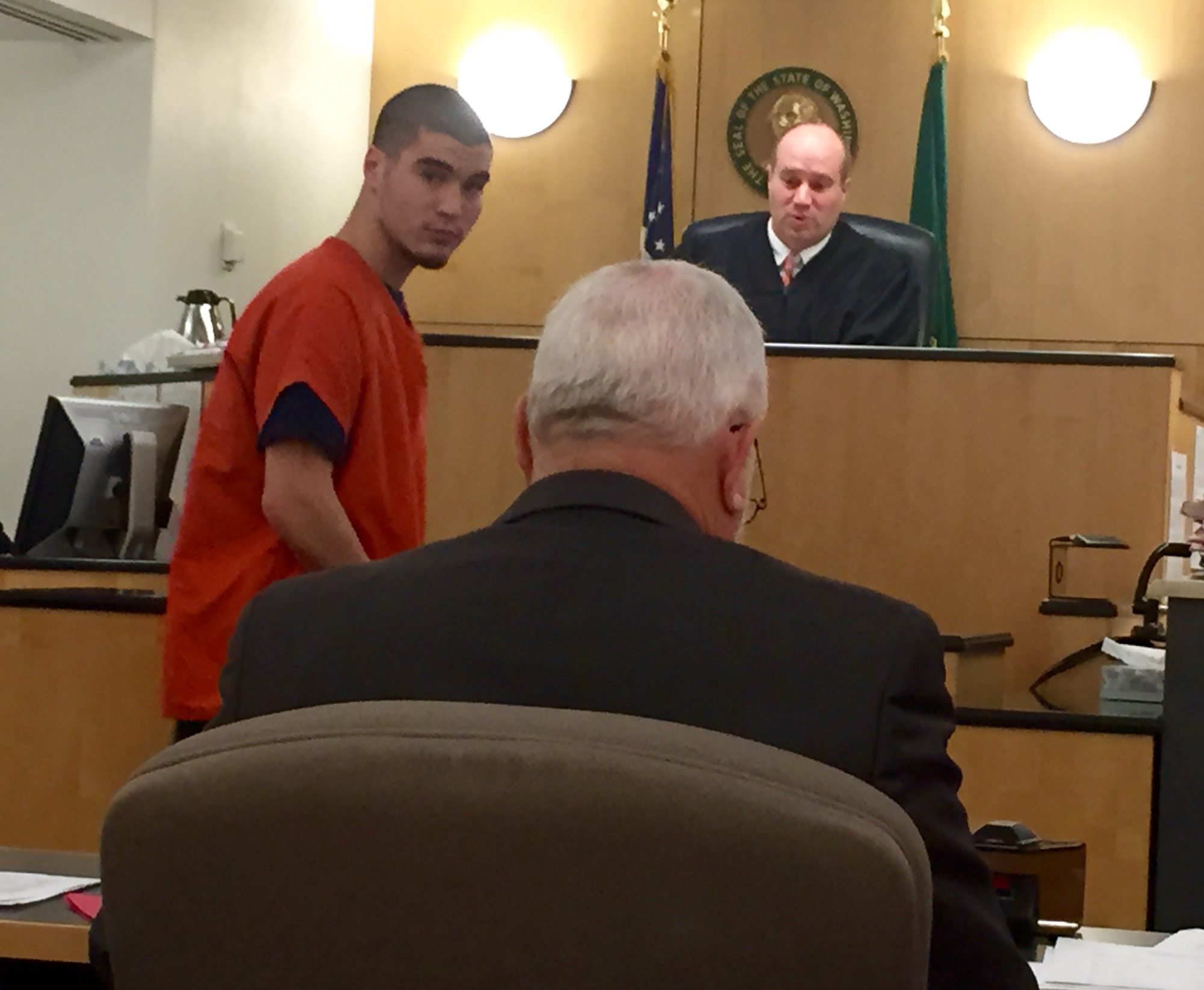 Spencer Pell, 19, left, makes a first appearance Wednesday in Clark County Superior Court on suspicion of first-degree assault stemming from an altercation in April that left a man in a coma. Another suspect in the attack was arrested earlier this month.