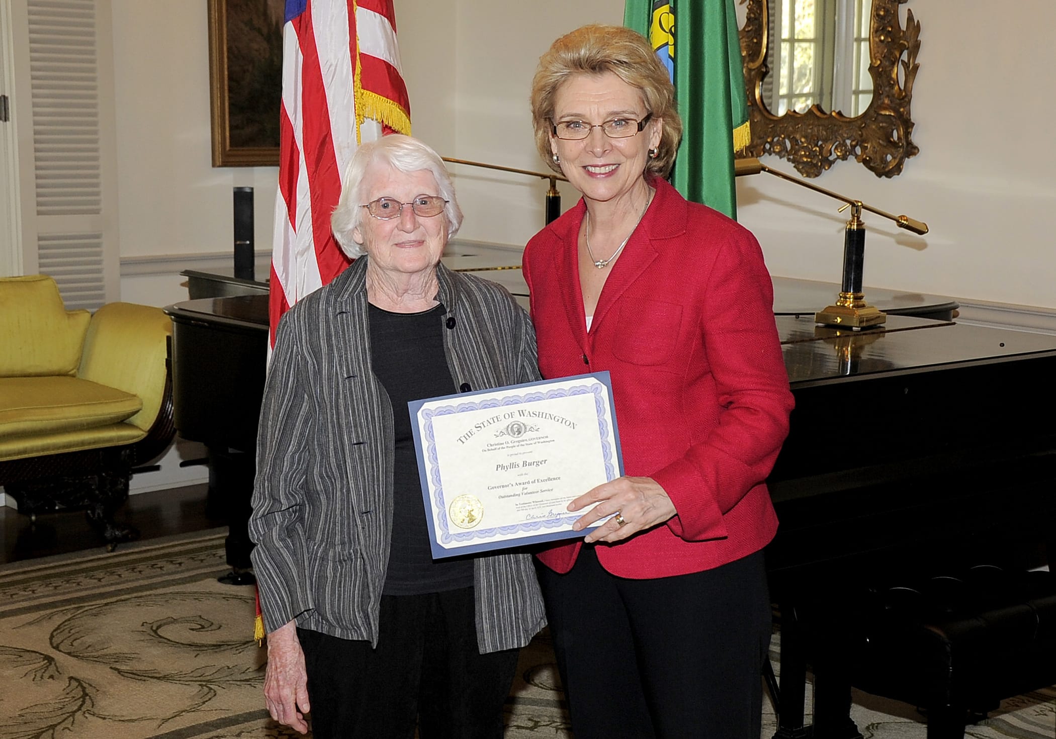 Office of the Governor
Gov. Chris Gregoire presents Phyllis Burger of Ridgefield with a Governor's Volunteer Service Award last month in Olympia.