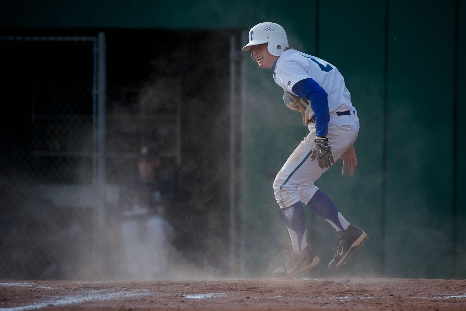 Mountain View's Dean Taylor jumps back to his feet after sliding in to home to score Mountain View's first run in a three-run second inning againt Decatur.