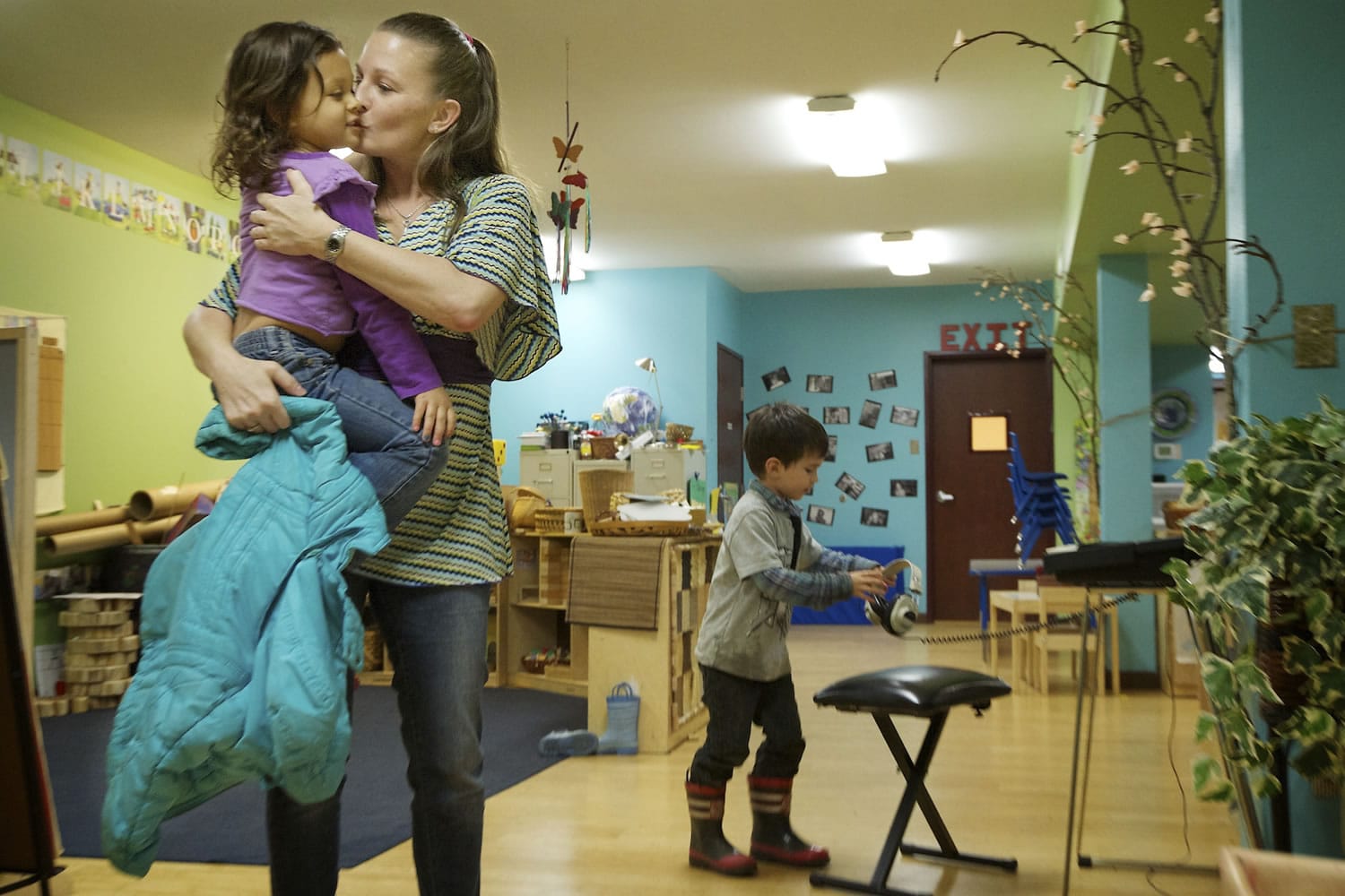 Rachel Collins picks up her daughter, 4-year-old Alexis, at Y's Care, the on-site child care program run by the YWCA Clark County. Y's care is affordable to low-income families and allows single moms, such as Collins, to work.
