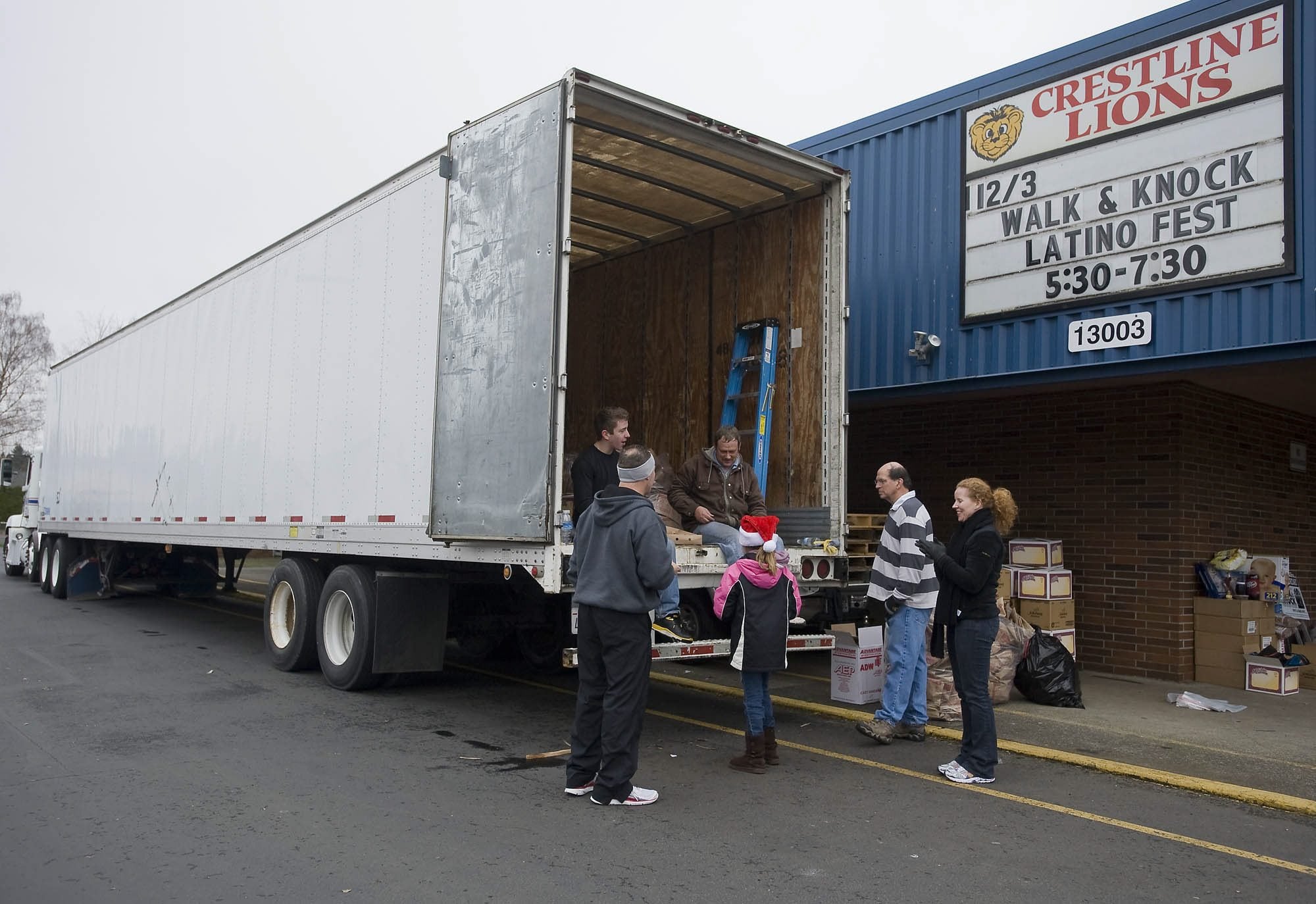 Volunteers at Crestline Elementary in east Vancouver pause to catch their breath Saturday after several hours of loading boxes of donated food during the annual Walk &amp; Knock food drive.