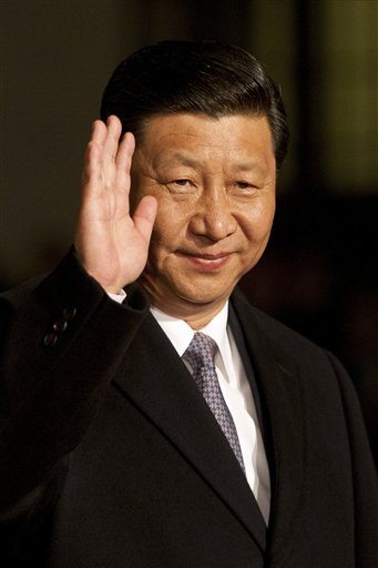 In this June 9, 2011 file photo, China's Vice President Xi Jinping waves in Santiago, Chile. The man destined to become the next leader of China has arrived in the U.S. on a visit that will include a welcome at the White House.