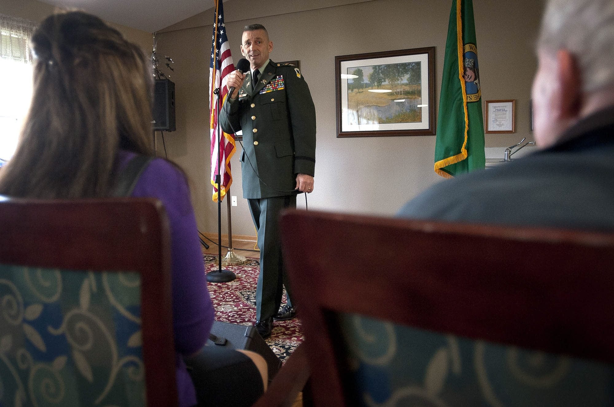 Zachary Kaufman/The Columbian
Col. Daniel Kern sings to honor three World War II veterans who live at Mountainview House Assisted Living in Camas.