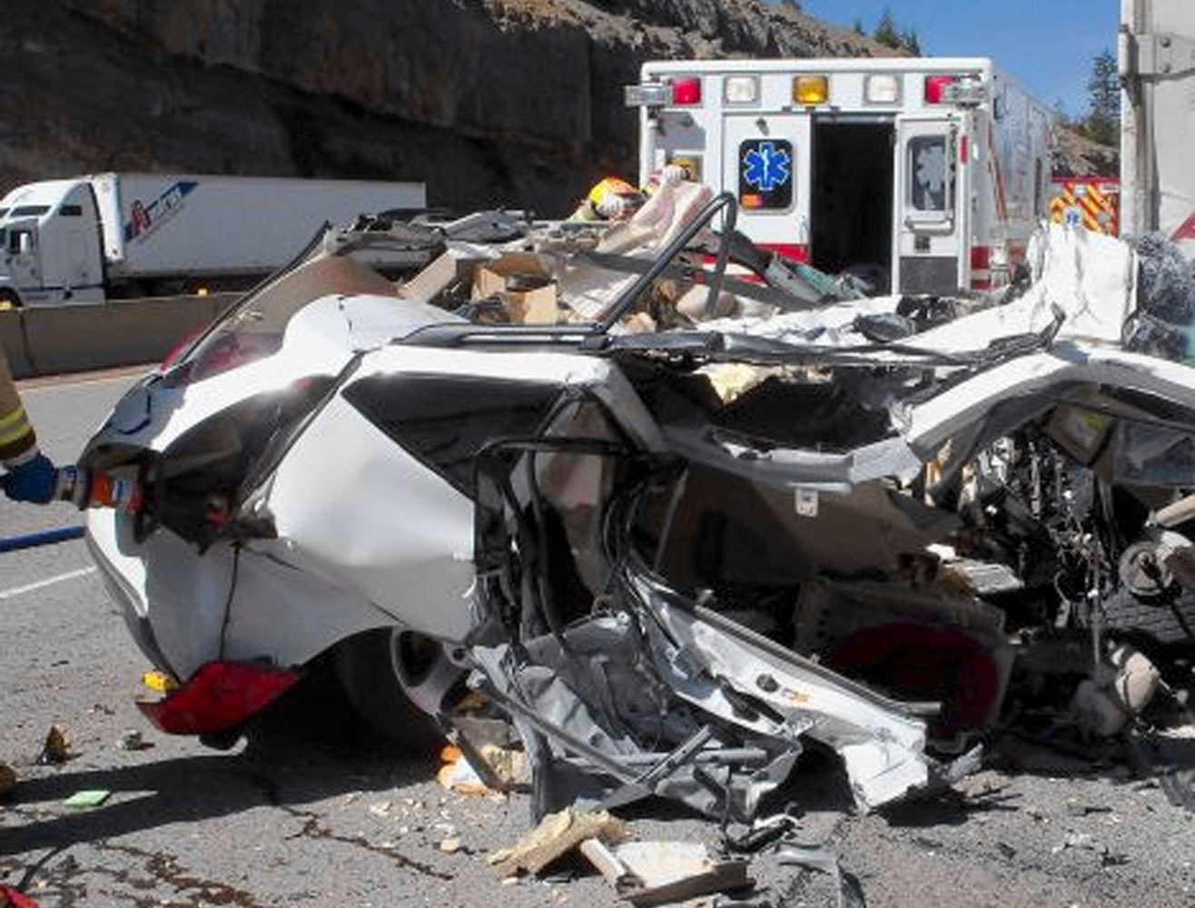 The wreckage of a car driven by Carol Dunsmore, 75, of Vancouver sits on Interstate 5 near Siskiyou Summit in Oregon.