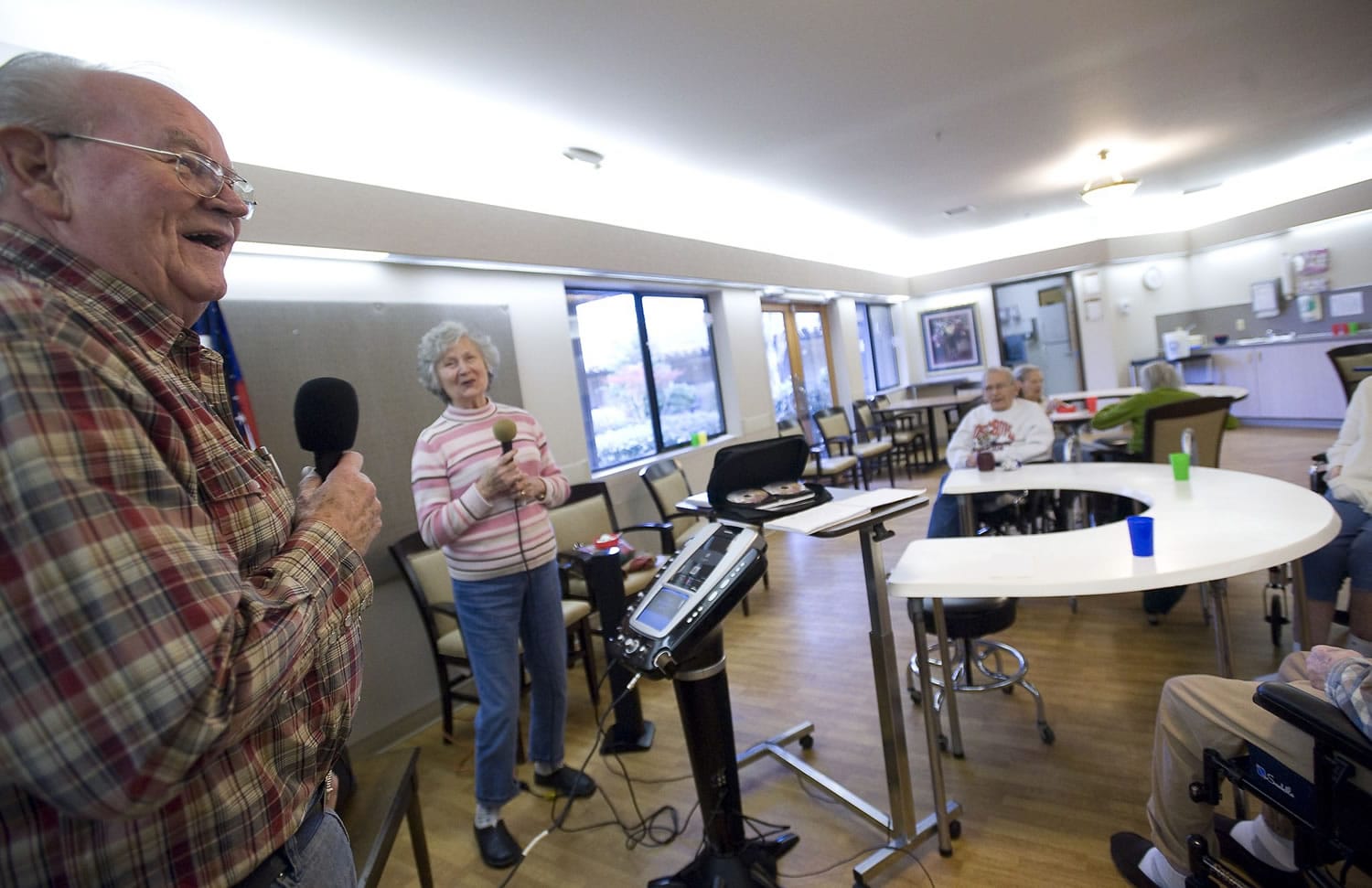 Lenard and Faye Davis entertain a group of seniors at Vancouver's Caretique memory care facility. Faye was diagnosed with Alzheimer's disease in 2006. Lenard uses the performances as an opportunity to relieve stress and keep their minds off the disease.