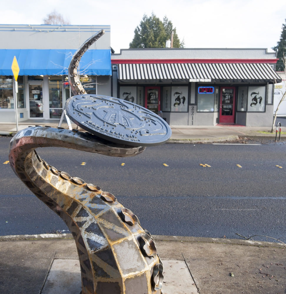 Vancouver&#039;s newest piece of public art, &quot;The Visitor,&quot; busts out of a manhole at West 23rd Street and Main.