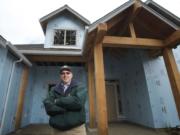 Jon Girod of Quail Homes stands in front of a home under construction in Battle Ground.