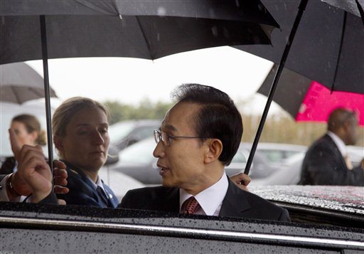 South Korean President Lee Myung-bak is escorted in the rain to his car at the Pentagon, Wednesday, Oct. 12, 2011, after his meeting with Defense Secretary Leon Panetta.