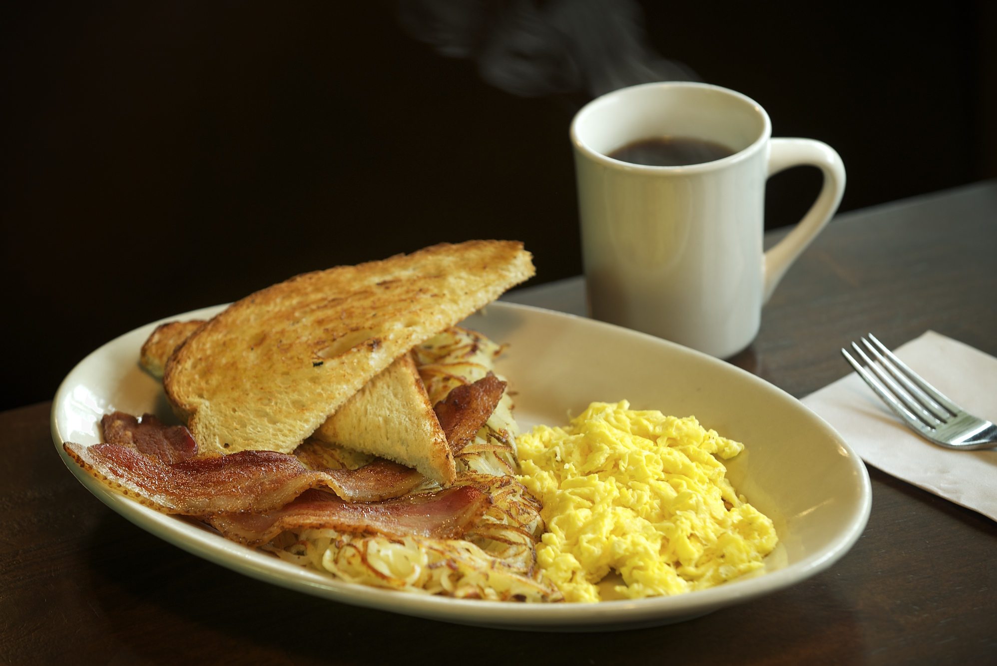 The half-order of the Cookhouse Platter includes eggs; ham, bacon or sausage; hash browns; and either toast or a biscuit.
