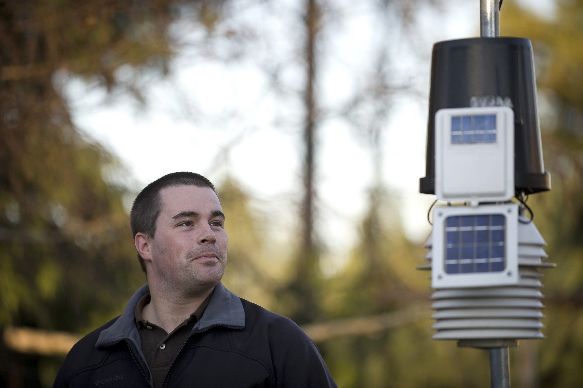 Tyler Mode shows off one of his two weather stations, which measures humidity, rain and temperature, at his parents' Vancouver home. Mode's other station is at his home in Battle Ground.